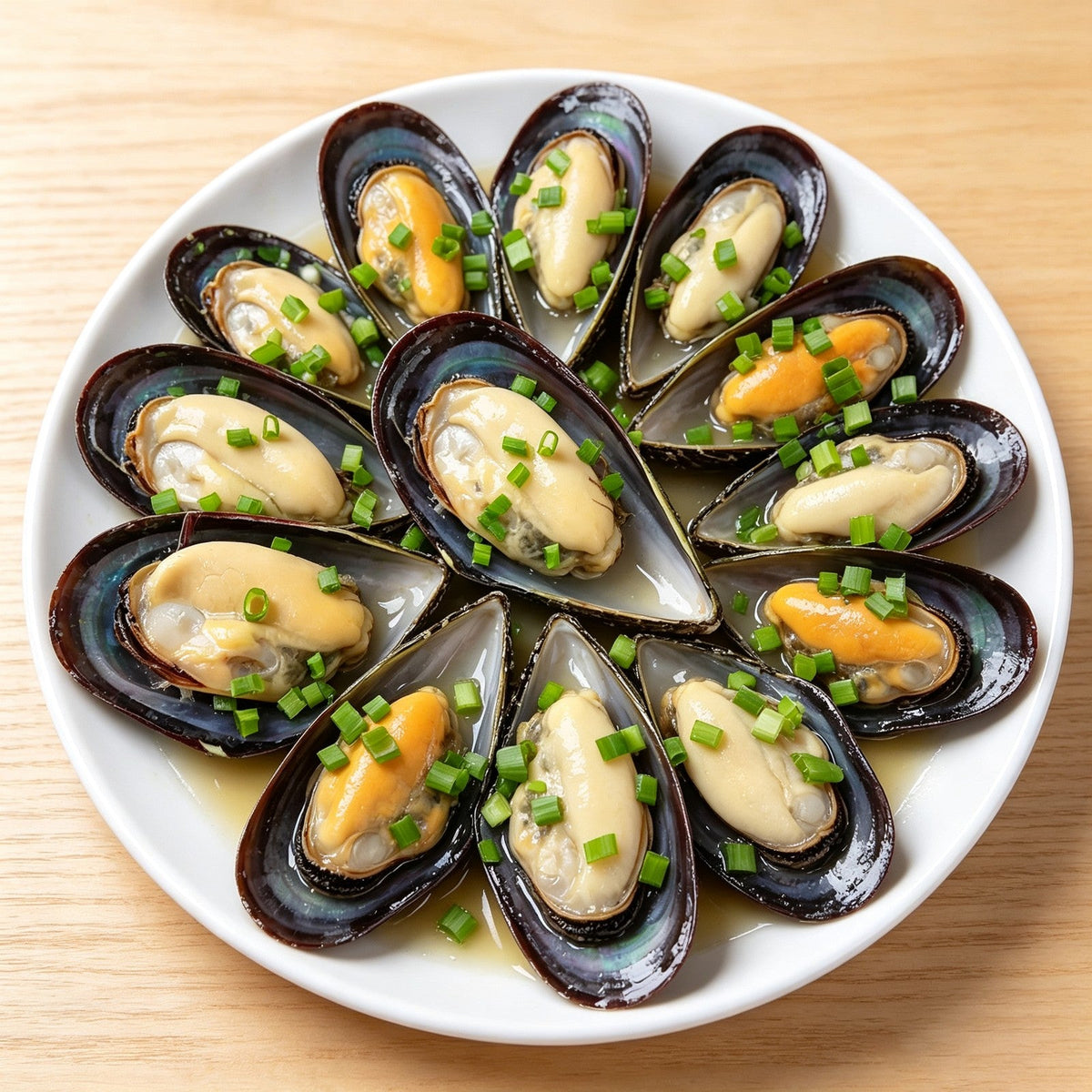 Steamed mussels arranged in a ring with garlic and parsley